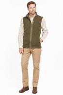Olive fleece waistcoat with full zip front and stand collar, worn with trousers.