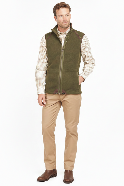 Olive fleece waistcoat with full zip front and stand collar, worn with trousers.