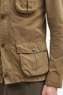 Olive-brown cotton jacket with two flap pockets and snap details