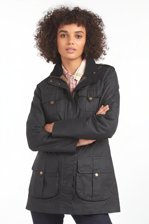 Barbour dark lightweight jacket with high stand collar and buttoned front pockets, standing pose