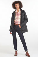 Barbour dark lightweight jacket with buttoned flap pockets and zip front, worn open at waist