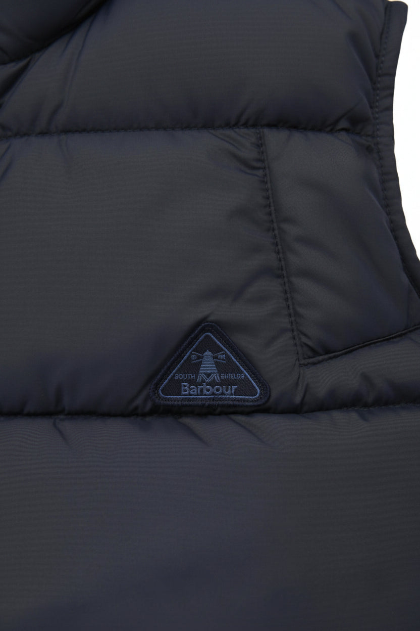 Navy quilted gilet with Barbour logo patch and quilted panel seams