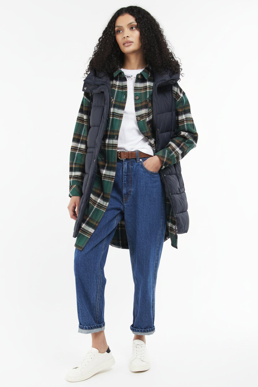 Navy quilted hooded gilet over plaid shirt, with jeans and front pockets