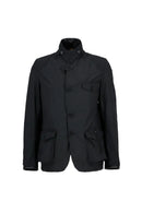Men's black wax jacket with high collar, button placket, and chest flap pocket