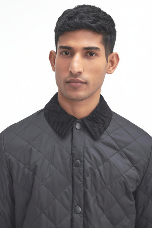 Men's black quilted jacket with stand collar and snap button front