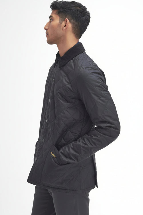 Men's black quilted jacket, side view, Barbour logo on sleeve