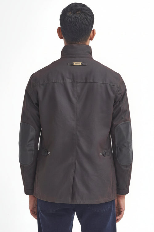 Men's Barbour wax jacket in dark brown, back view with stand collar tag and flap pockets.