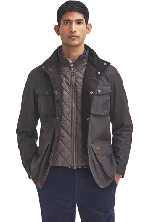 Men's Barbour wax jacket in dark brown with four snap pockets, stand collar, zip front.