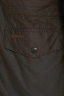 Men's olive wax jacket chest pocket with Barbour label and dark button