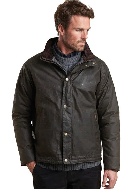 Men's wax jacket with dark olive finish, brown lined stand collar and snap buttons.