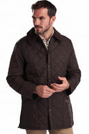 Men's dark brown quilted Barbour jacket with cord collar and button placket detail