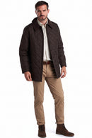 Men's dark brown quilted Barbour jacket with cord collar and button front