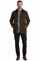 Men's olive wax jacket with shirt collar showing; flap pockets and button-front closure.