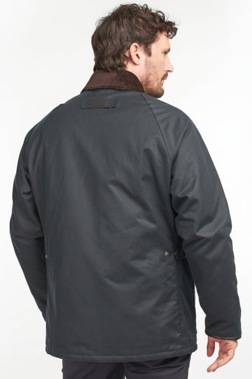 Men’s navy wax cotton jacket back view, with small back logo patch