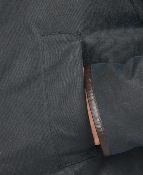 Navy wax cotton jacket inner seam and lining, with brown leather trim tag