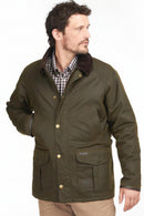 Olive wax cotton jacket with Barbour-style metal buttons and cord collar, side view