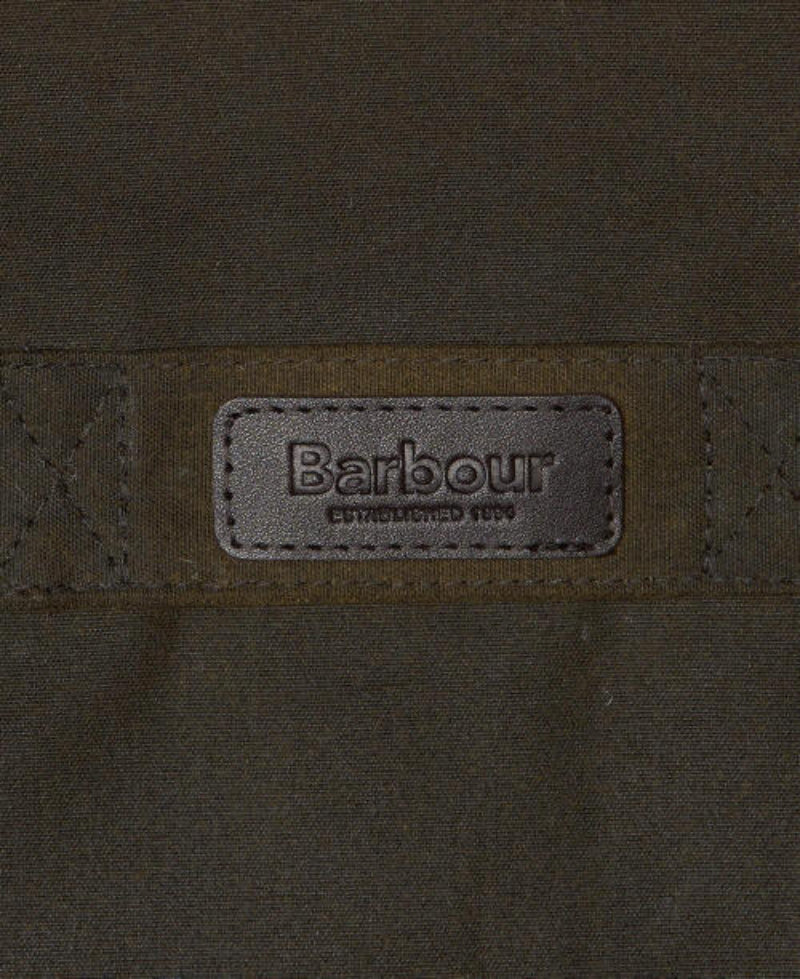 Barbour logo label on olive wax cotton jacket chest panel