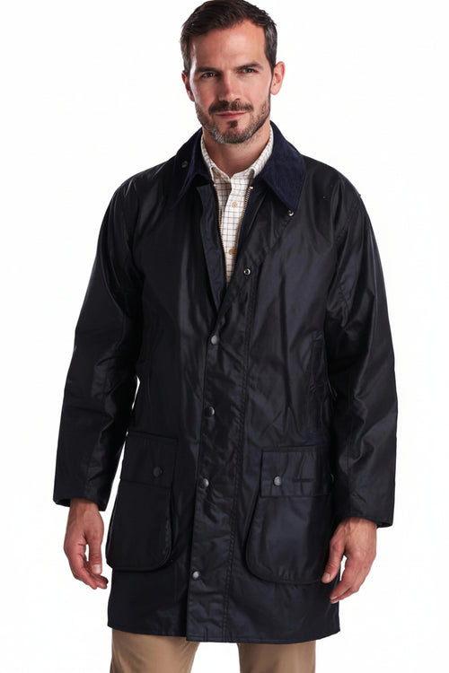 Men's navy wax jacket with stand collar, two flap pockets, button-down front