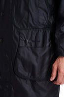Men's navy wax jacket, button front, stand collar, chest label detail