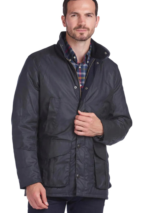 Navy wax jacket with stand collar, flap pockets, and front button closure