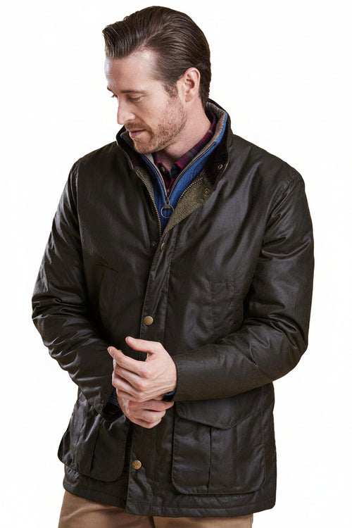 Men's Barbour wax jacket with stand collar; blue striped lining visible; dark waxed fabric