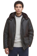 Dark waxed jacket with hood, snap flap pockets, and dark collar