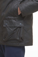Dark waxed jacket front flap pocket with snap buttons and stitched panel