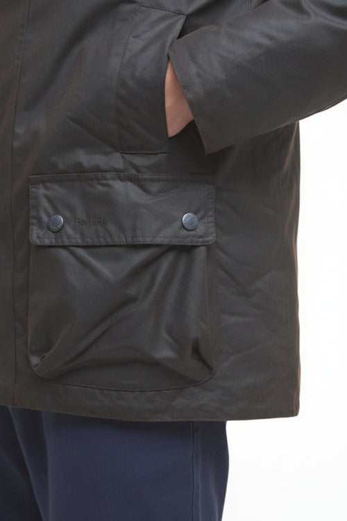 Dark waxed jacket front flap pocket with snap buttons and stitched panel