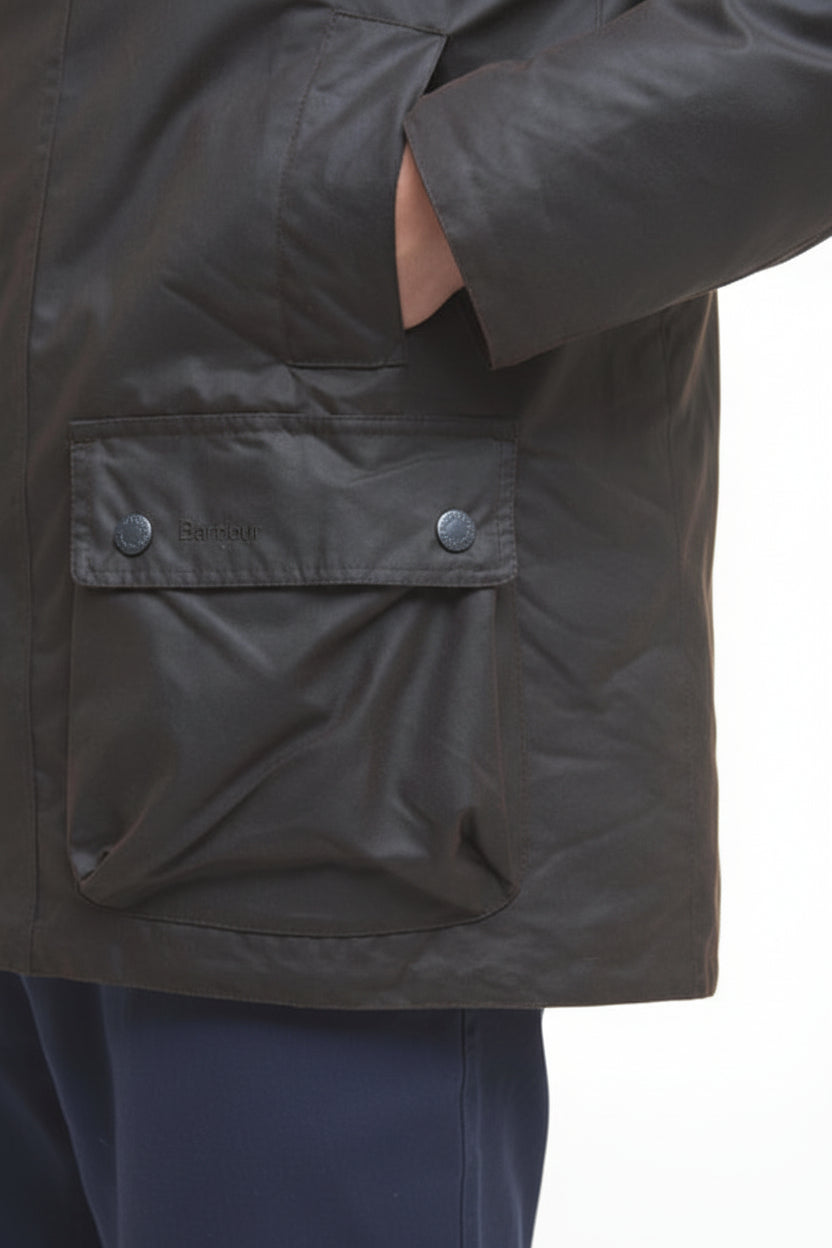 Dark waxed jacket front flap pocket with snap buttons and stitched panel