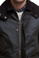Dark waxed jacket with exposed zip front and check-lined collar