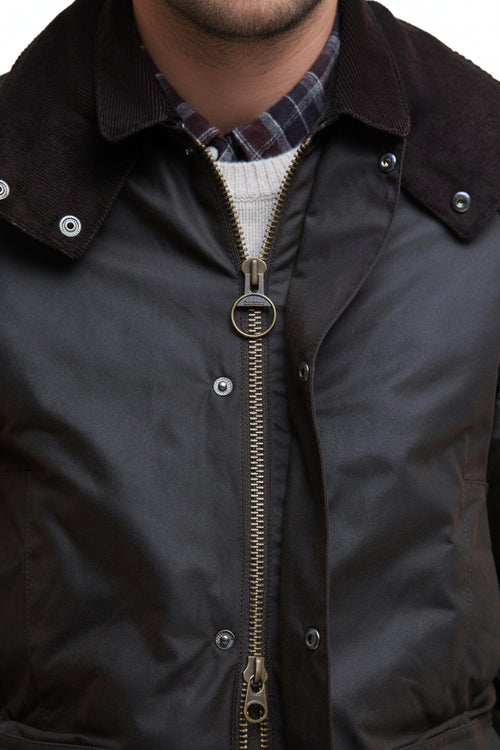 Dark waxed jacket with exposed zip front and check-lined collar