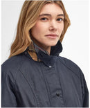 Navy women's wax jacket with cord collar and buttoned stand-up neckline detail