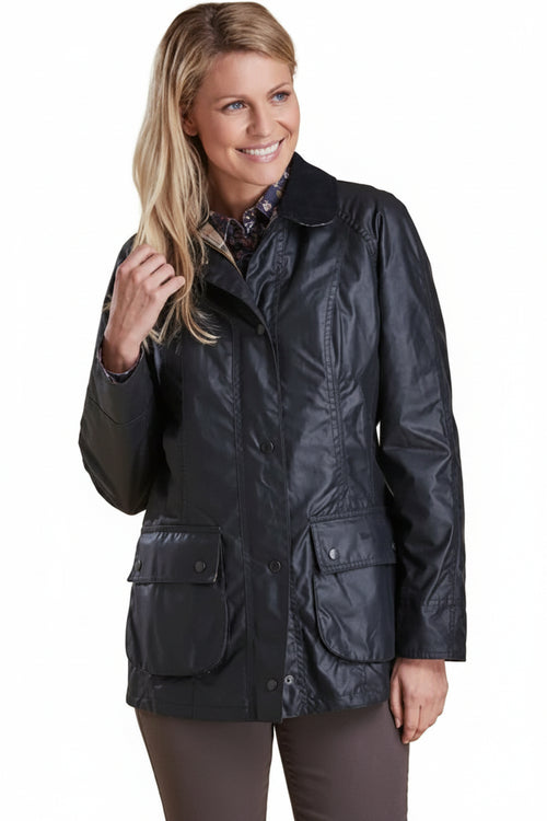 Navy wax Beadnell jacket with button front and patch pockets at chest and waist