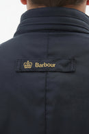 Men's navy wax jacket back yoke with Barbour brand patch near the collar
