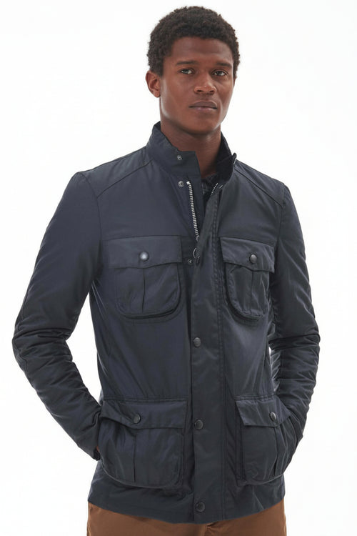 Men's navy wax jacket with stand collar, zip front, and flap chest pockets