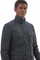 Men's navy wax jacket close-up with stand collar, button placket, and chest pockets