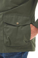Men's olive waterproof jacket front pocket flap with brass snap and button placket