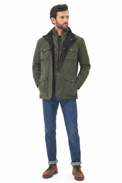 Men's olive waterproof jacket with button-front and flap pockets over denim