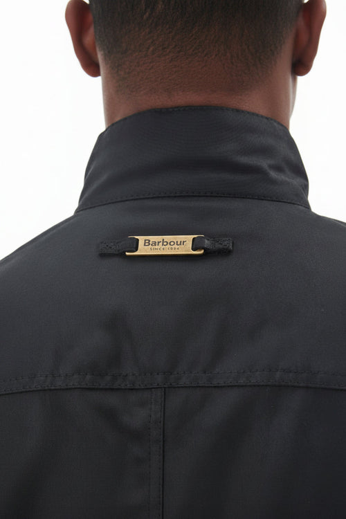 Men's black wax jacket back collar with Barbour logo tab