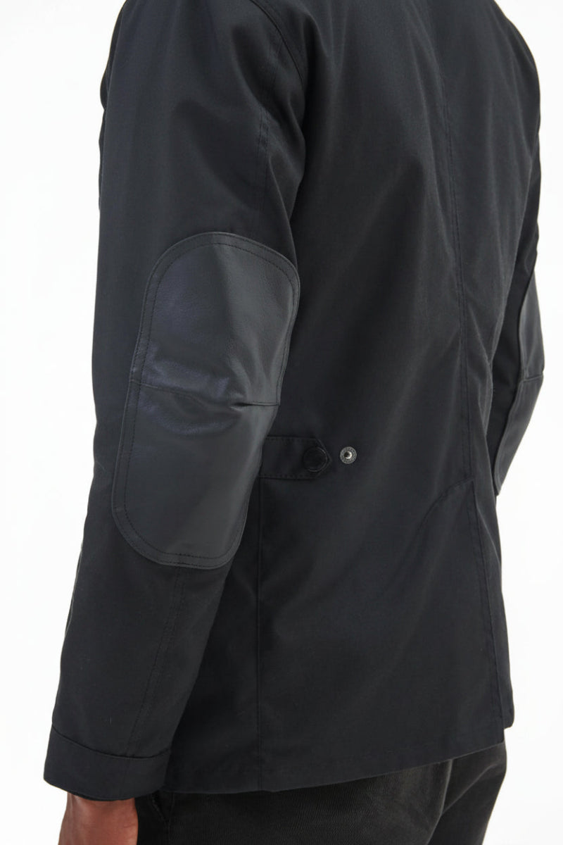 Men's black wax jacket sleeve and shoulder with snap cuff detail