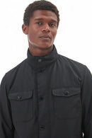 Men's black wax jacket front view with two flap pockets and button placket