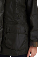 Dark olive jacket with flap pocket and plaid inner cuff detail.