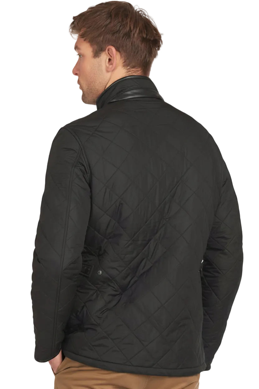 Back view of black quilted jacket with diamond pattern and stitched seams