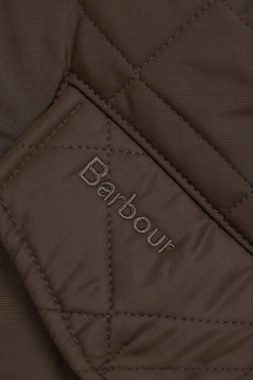 Quilted olive jacket inner patch with Barbour logo stitch details