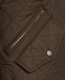 Quilted olive jacket front zip placket with snap button and Barbour logo patch