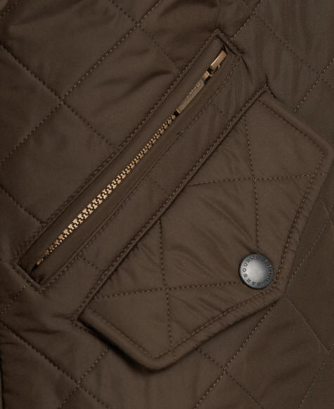 Quilted olive jacket front zip placket with snap button and Barbour logo patch