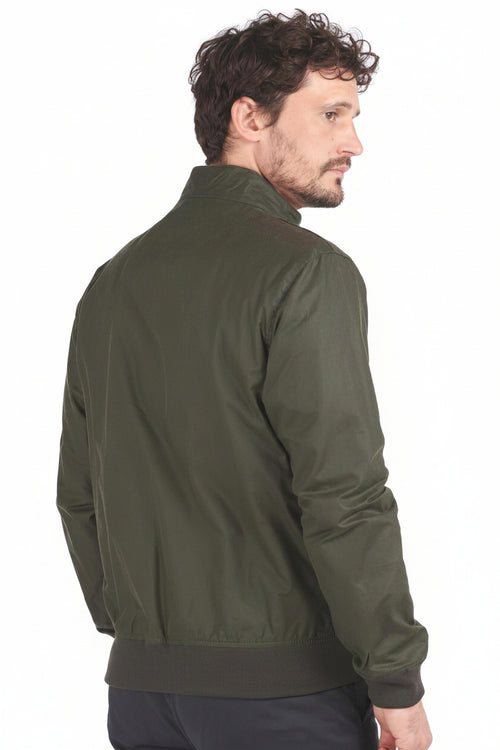 Olive waxed cotton jacket side view with ribbed collar and cuffs