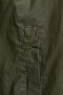Olive waxed cotton jacket with stitched front logo placket