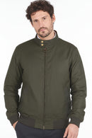 Olive Barbour waxed cotton jacket with stand collar, gold snaps, and zip