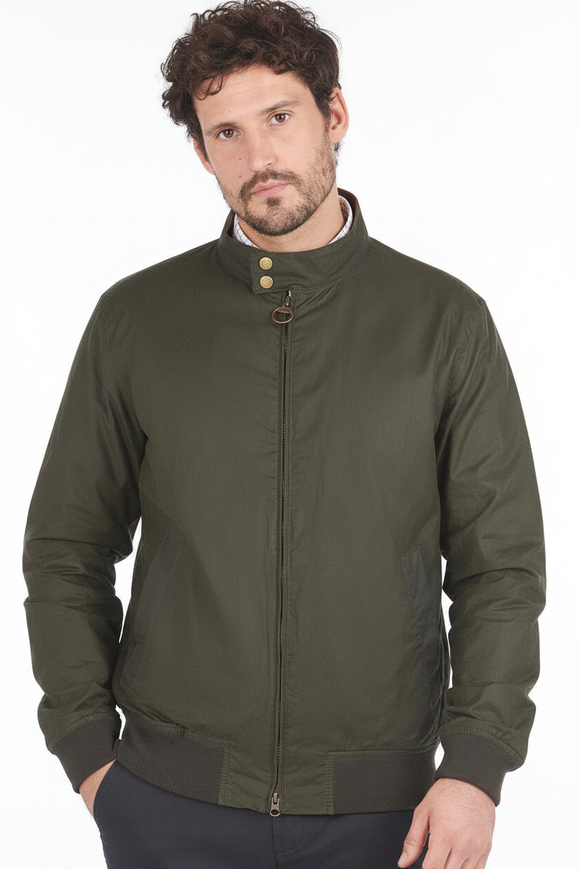 Olive Barbour waxed cotton jacket with stand collar, gold snaps, and zip